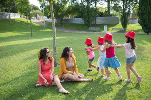 Children Playing Beside Their Moms